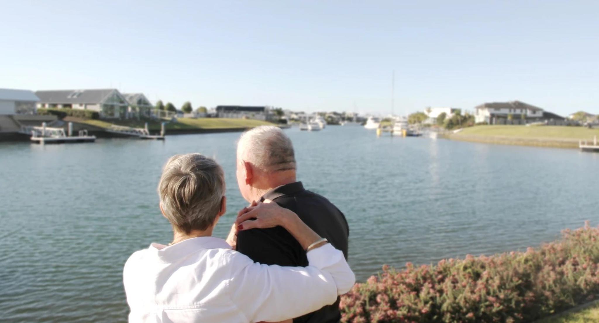 A couple enjoying the view from Marlin Waters Lifestyle Village in Whitianga — a peaceful option for over-50s looking to settle into coastal living.